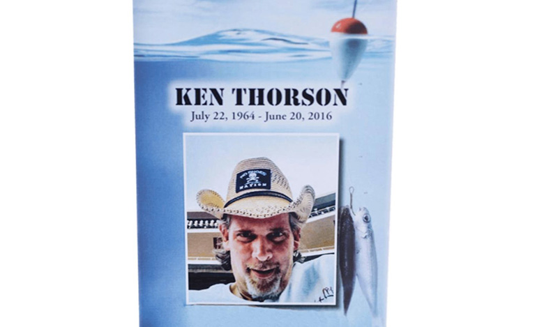 A memorial card for Ken Thorson, with dates July 22, 1964 – June 20, 2016. Perfect for life celebrations, it features his photo in a straw hat, along with an image of a fish and a fishing bobber floating on water.