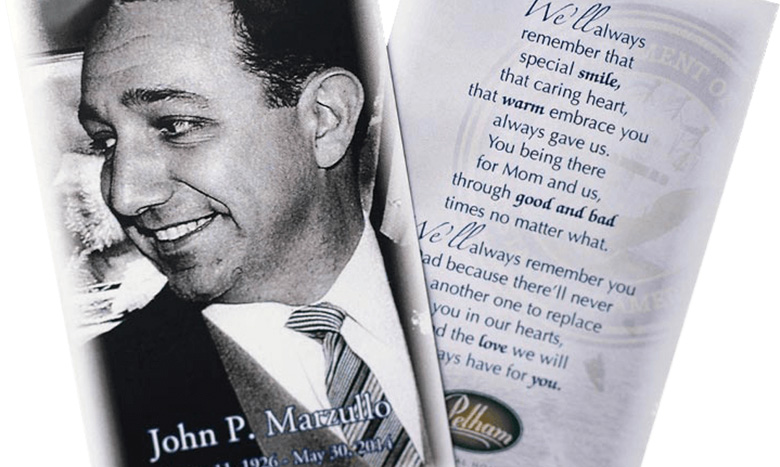 A black and white photo of a smiling man in a suit appears on a memorial card. Next to it, text includes a heartfelt remembrance poem, honoring John P. Marzullo with his birth and death dates—celebrating his life and legacy.
